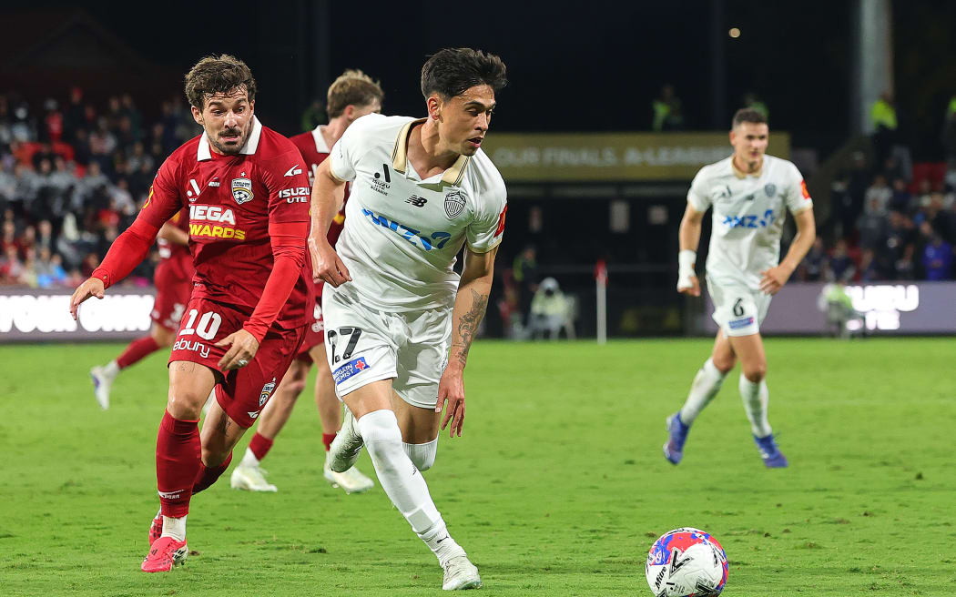 ADELAIDE, AUSTRALIA - MAY 15: Logan Rogerson of Auckland. and Juan Muniz of Adelaide United during the Leg 2 of the A-League Men Elimination Final series between Adelaide United and Auckland FC at Coopers Stadium, on May 15, 2026, in Adelaide, Australia. (Photo by Sarah Reed/Getty Images)