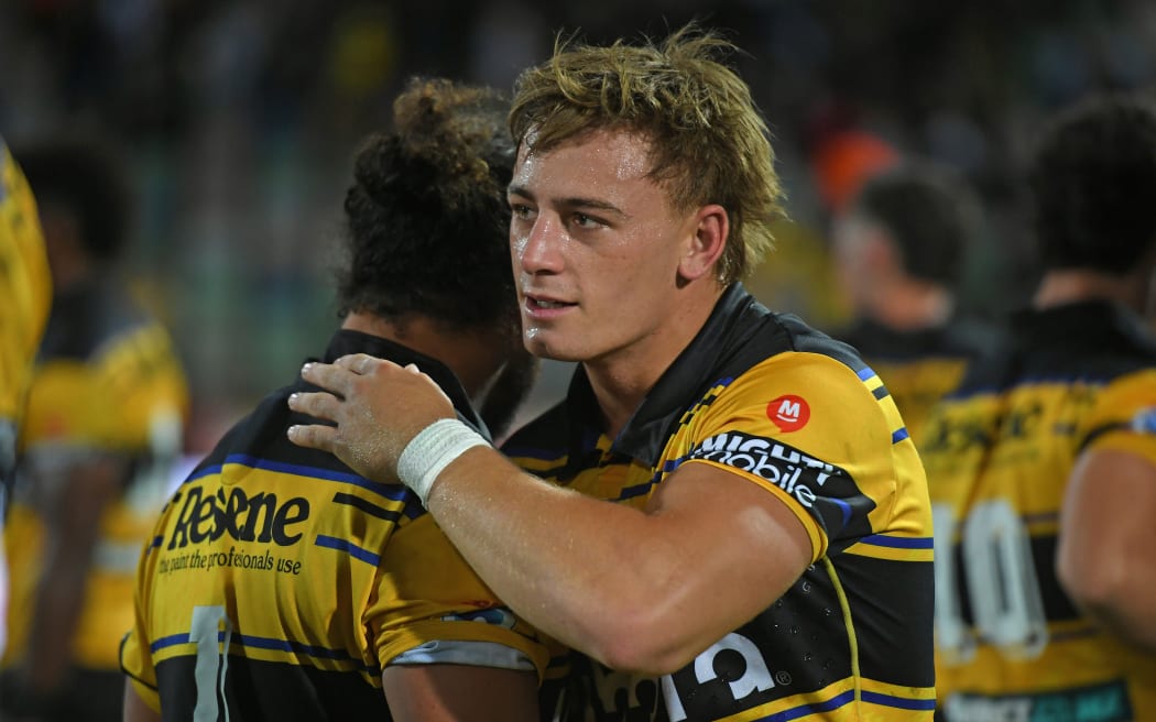 Hurricanes player Ruben Love congratulates a teammate.