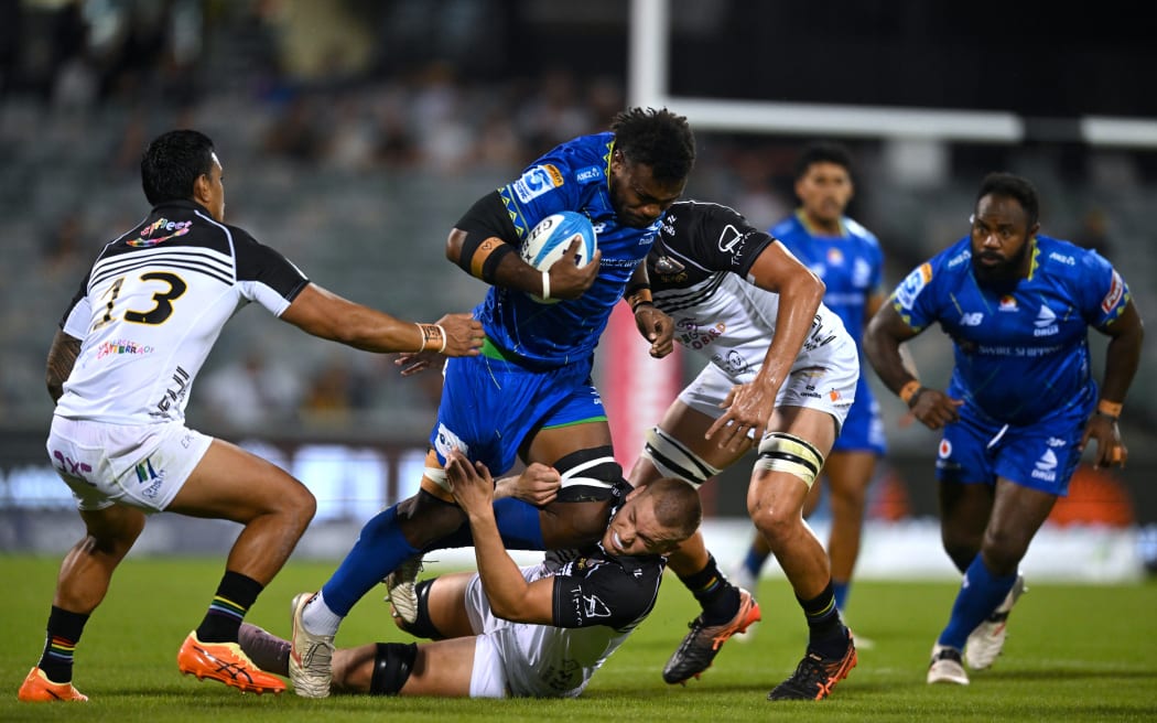 Elia Canakaivata of the Drua is tackled by Charlie Cale of the Brumbies during the Super Rugby Pacific Round 5 match between the Brumbies and the Fijian Drua at GIO Stadium in Canberra, Friday, March 14, 2025. (AAP Image/Lukas Coch / Photosport) NO ARCHIVING, EDITORIAL USE ONLY