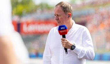 Martin Brundle speaks into a Sky Sports microphone
