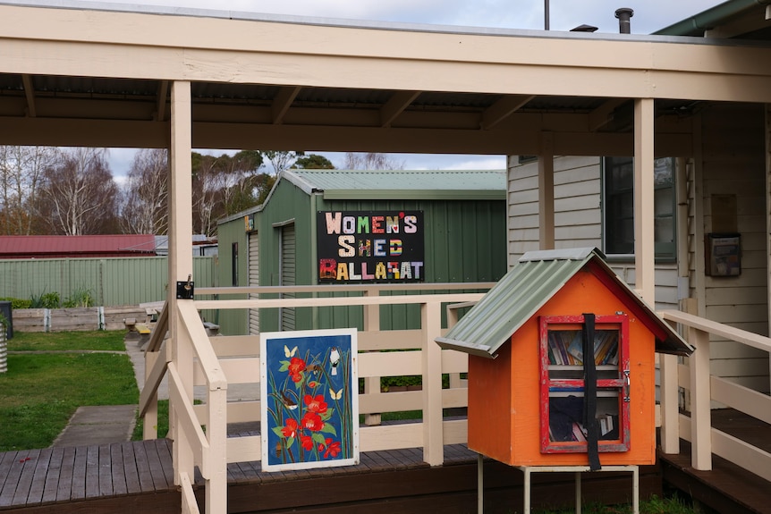 a shed and building with a book library