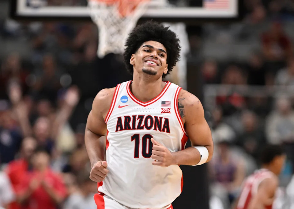 Arizona Wildcats forward Koa Peat (10) reacts after a pay against the Arkansas Razorbacks in the second half during a Sweet Sixteen game of the West Regional of the men's 2026 NCAA Tournament at SAP Center.