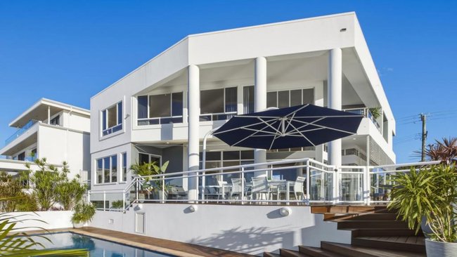 The Broadbeach Waters mansion owned by the couple behind four liquidated Gold Coast Boost Juice stores is set to go to auction later this month.