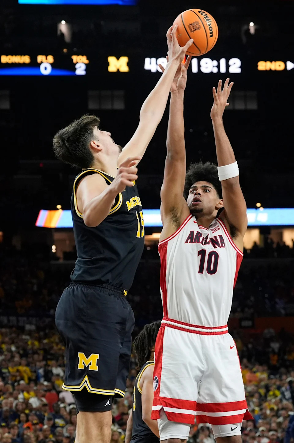 Michigan center Aday Mara (15) blocks Arizona forward Koa Peat (10) shot in the second half of their Final Four game at Lucas Oil Stadium in Indianapolis on Saturday, April 4, 2026.