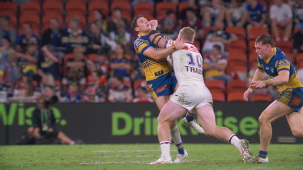 Mitchell Moses is shoved away by Josh King in a tackle.