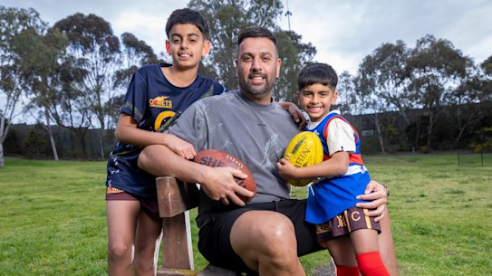 Balraj Singh, who was drafted to Adelaide 26 years ago, with six-year-old Memphis and 11-year-old Brooklyn.