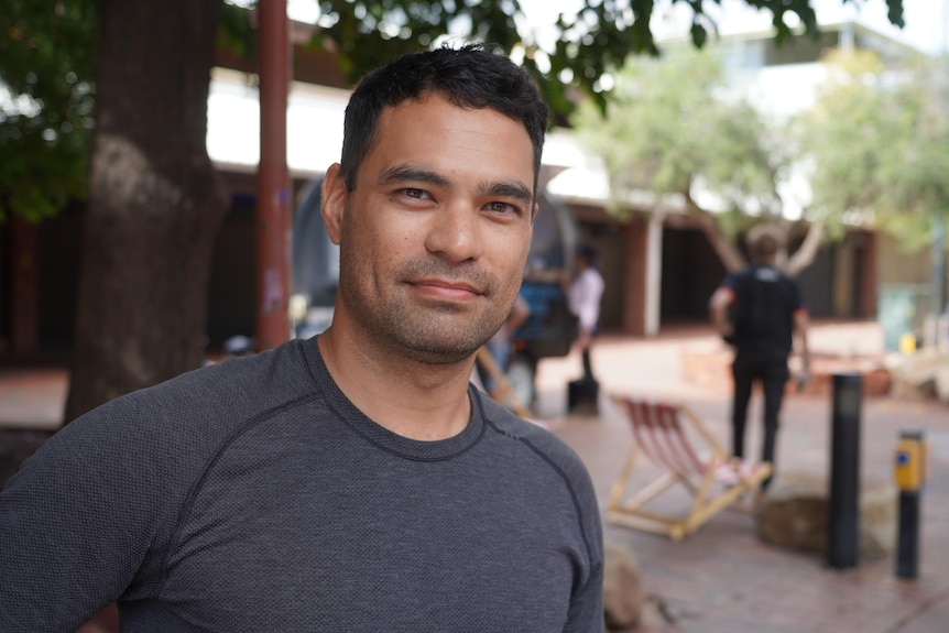 A man in a grey t shirt