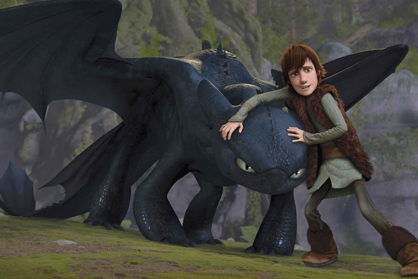Animation of young boy with brown hair standing with a black dragon on a cliff.