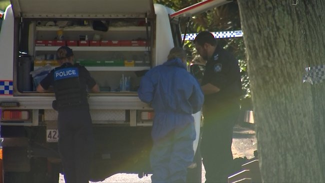 Forensic officers examined the scene after a woman’s body was discovered at a park in Hervey Bay.