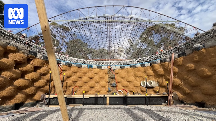 Home destroyed by fire rebuilt as an Earthship made of tyres, bottles and cans