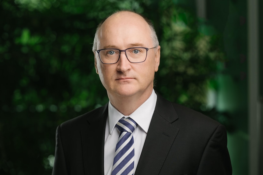 Bald man in dark suit