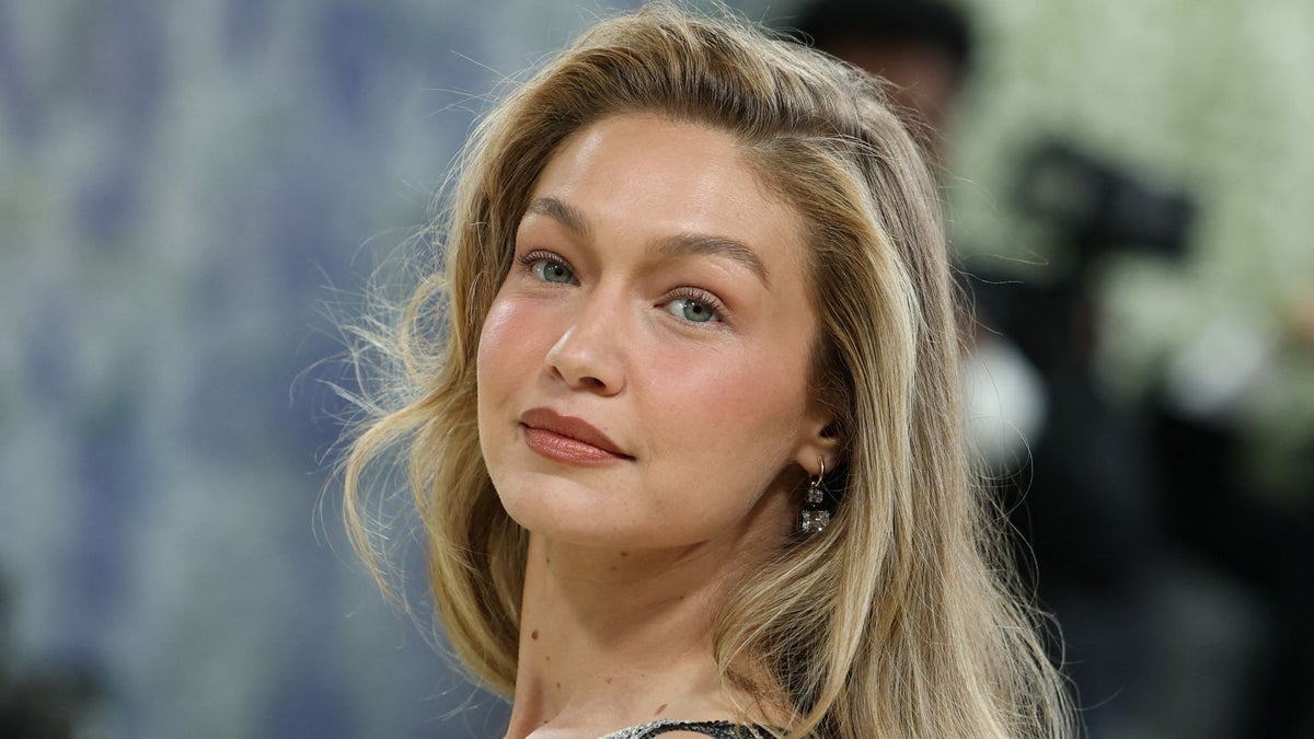 Gigi Hadid wears babydoll dress over jeans at Victoria’s Secret open casting call