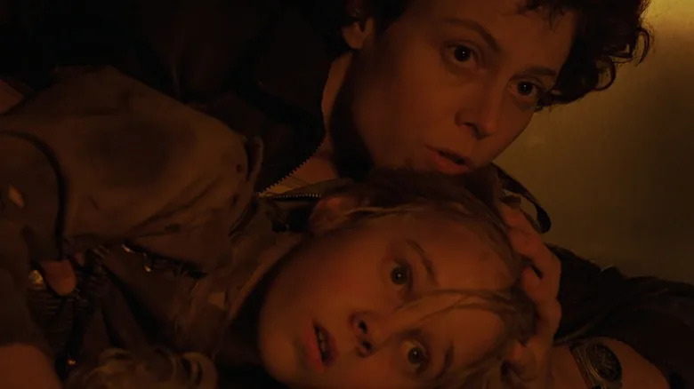 Ellen Ripley on the floor with Newt in Aliens