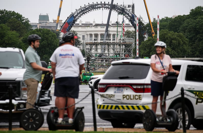 People on a Segway tour pass near the White House as construction continues for the upcoming UFC match. Photograph: Kevin Dietsch/Getty Images