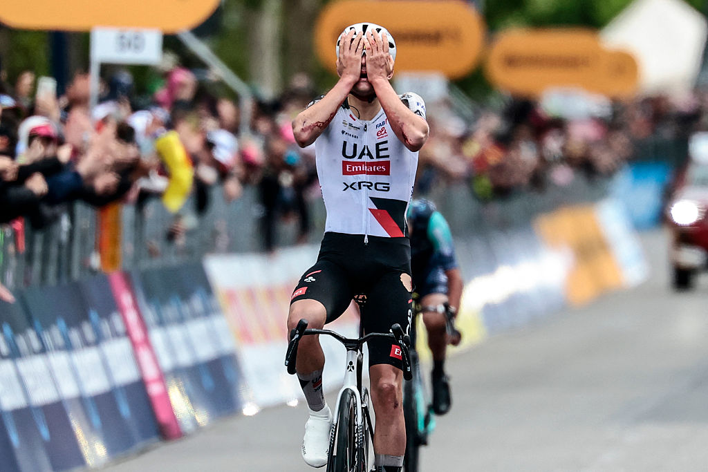UAE Team Emirates - XRG Spanish rider Igor Arrieta celebrates as he crosses the finish line to win the 5th stage of the Giro d'Italia 2026 - Tour of Italy cycling race between Praia a Mare and Potenza, southern Italy on May 13, 2026. (Photo by Luca BETTINI / AFP)