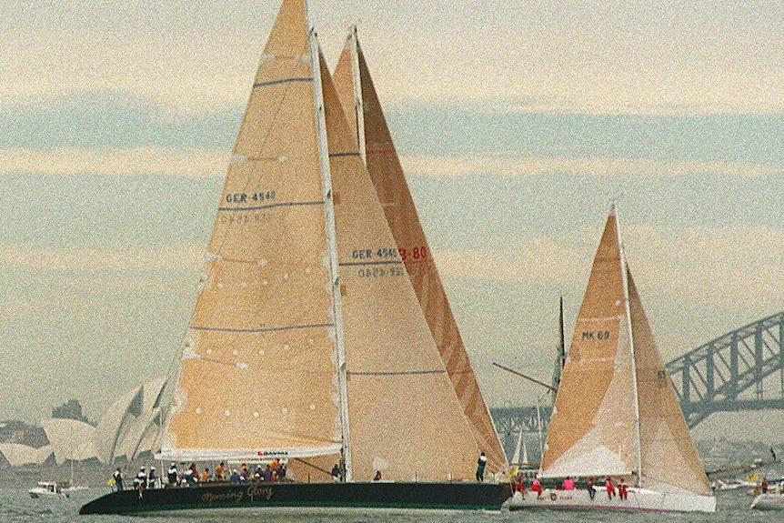 A large and small yach sailing on the Sydney Harbour