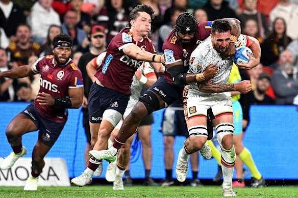 Josh Lord of the Chiefs attempts to break away at Suncorp Stadium.