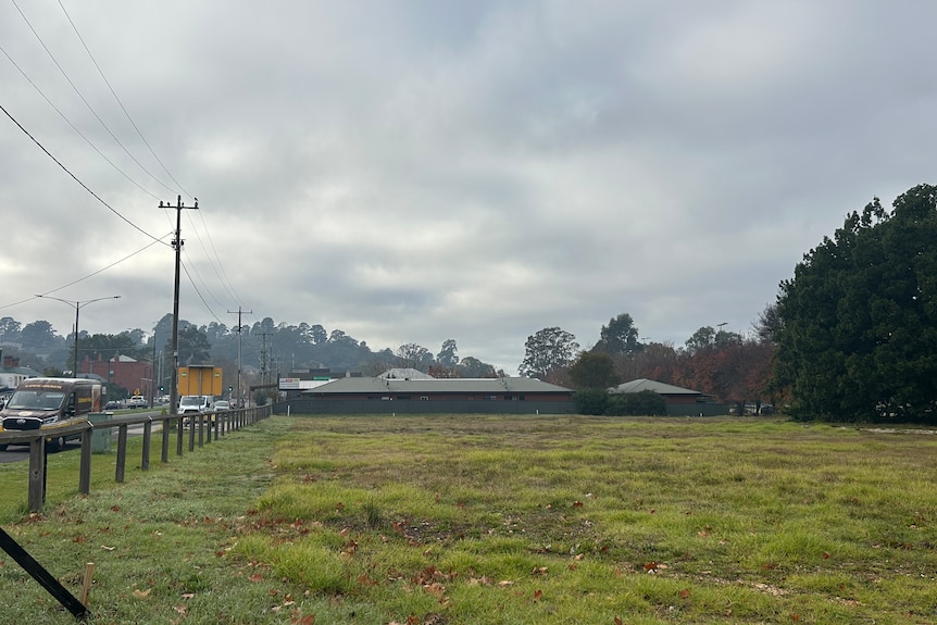 A vacant grassy block.