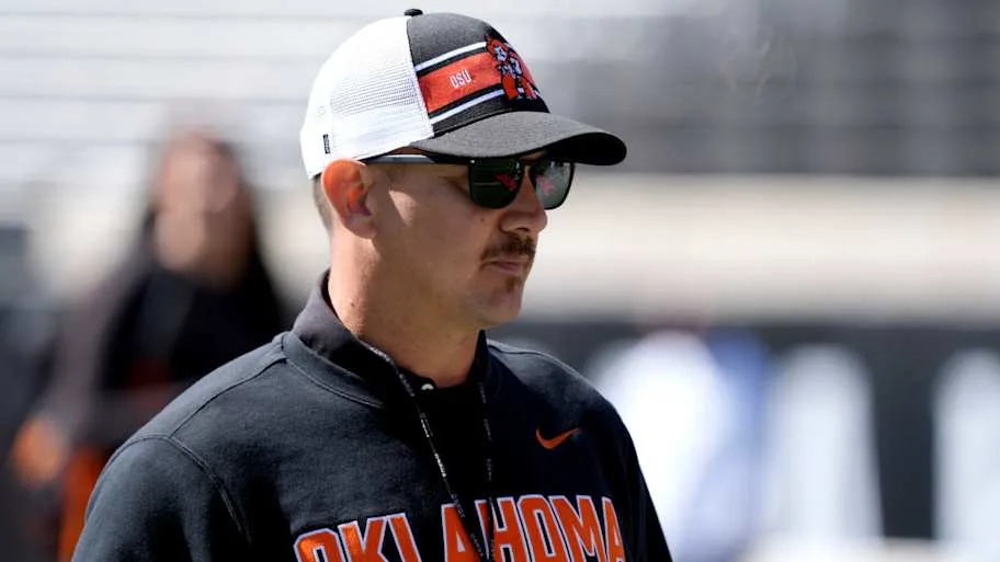 Oklahoma State head football coach Eric Morris watches action from the sideline