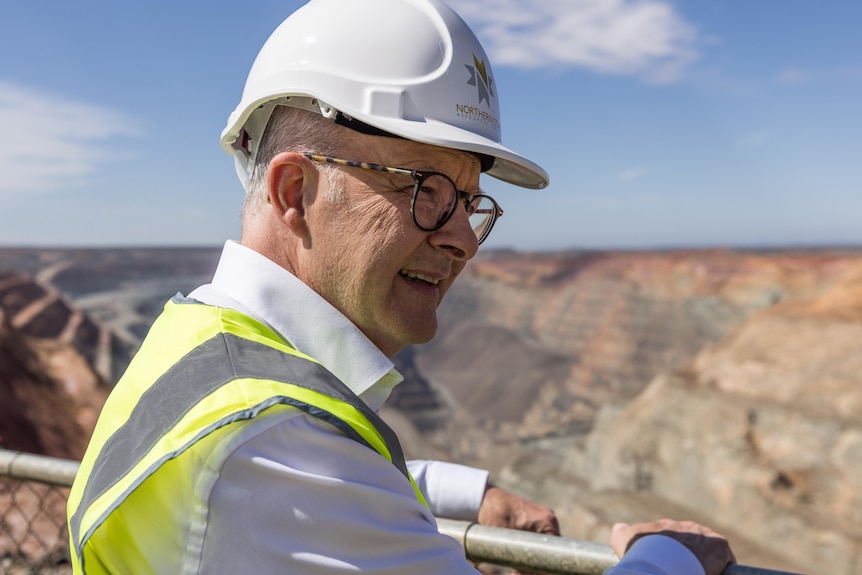 The Prime Minister at a lookout at an open cut gold mine.