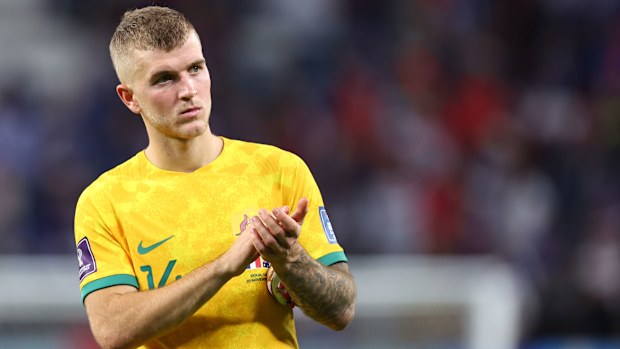 Riley McGree of Australia applauds the fans at full time after the Socceroos' 4-1 loss to France at the FIFA World Cup in Qatar.