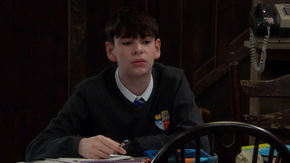 emmerdale kyle winchester a student engaged in schoolwork at a desk