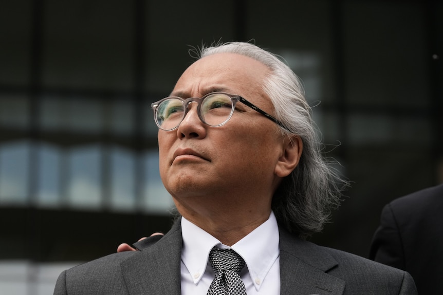 Kenneth Iwamasa wearing a suit