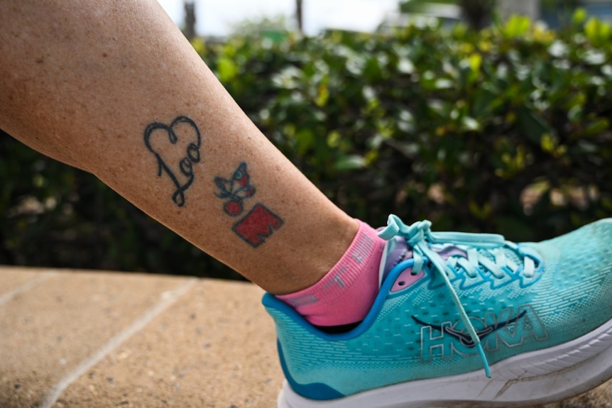 Tattoos on a woman's ankle