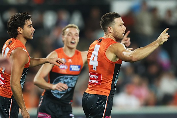 Toby Greene of the Giants celebrates kicking a goal.