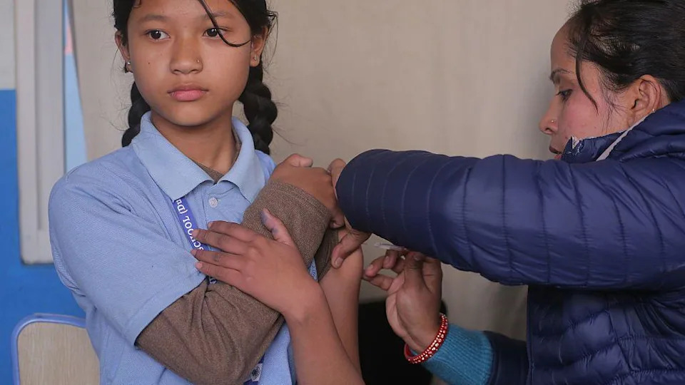 In Kathmandu, Nepal, on February 10, 2026, a Nepalese student receives a dose of the Human Papillomavirus (HPV) vaccine at a local school as part of a government vaccination campaign