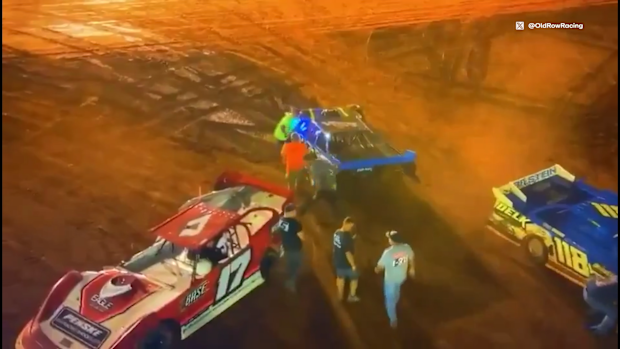 Greg Martin (blue car) was arrested and charged with aggravated assault after he used his car to ram a rival's after an on-track incident in the USA.