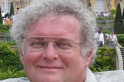 man with curly grey