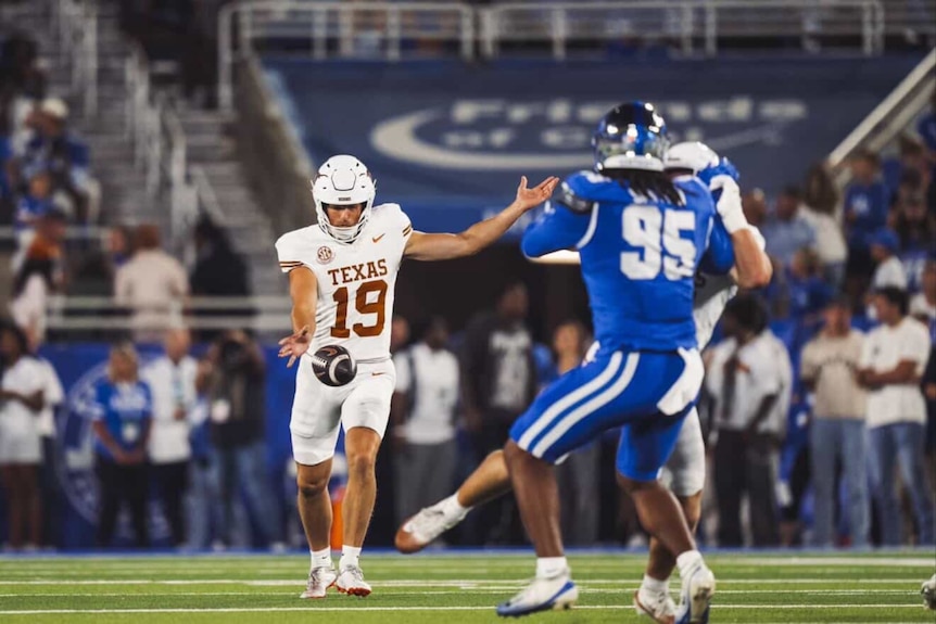 American footballers in blue and white uniforms.
