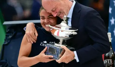 Italy's Jasmine Paolini and Angelo Binaghi, president of the Italian Tennis Federation, celebrate after victory in her women's singles final match against US's Coco Gauff during the WTA Rome Open in 2025.