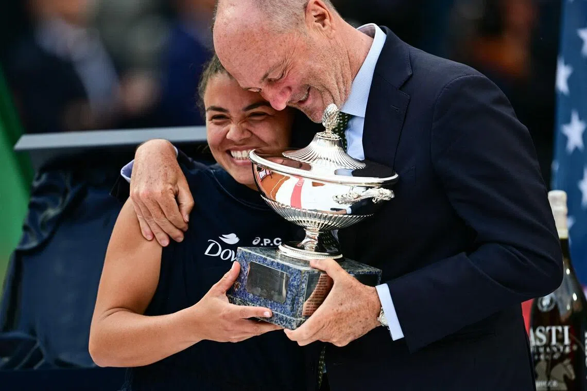 Italy's Jasmine Paolini and Angelo Binaghi, president of the Italian Tennis Federation, celebrate after victory in her women's singles final match against US's Coco Gauff during the WTA Rome Open in 2025.