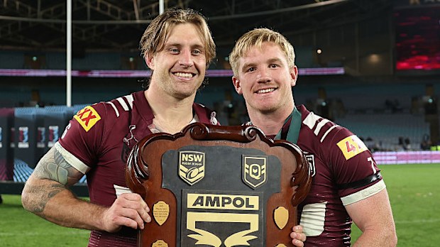 Cameron Munster and Tom Dearden of the Maroons celebrate with the State of Origin Shield.