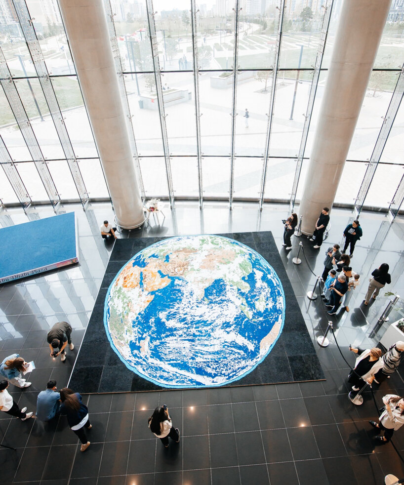 thousands of hand-rolled paper quills compose monumental mosaic earth artwork - 5