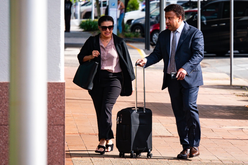 People walking outside court on a sunny day