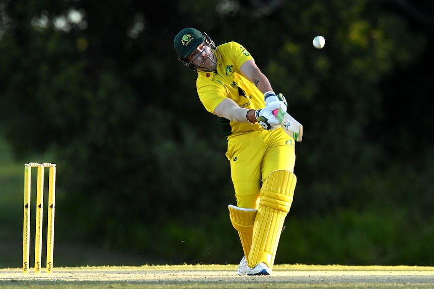 Callum Asbury, player for Australia's Deaf cricket team, hits the ball while batting