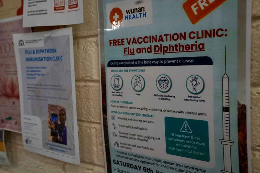 A laminated poster urging people to get vaccinated against diphtheria