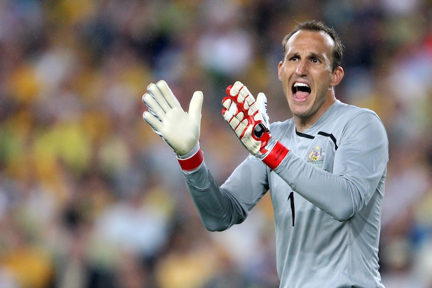 Socceroo Mark Schwarzer shouts encouragement to his team-mates during the 2010 FIFA World Cup qualifying match