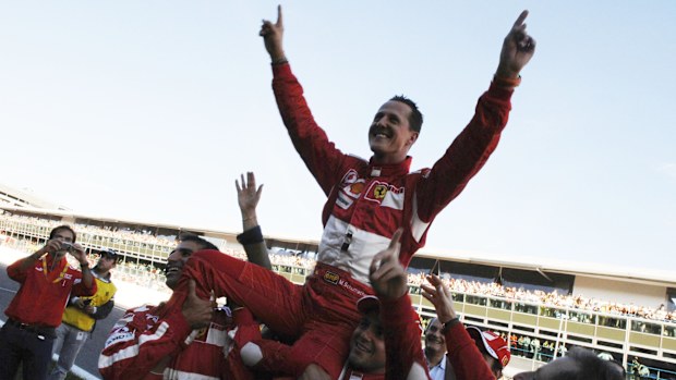 German Ferrari driver Michael Schumacher waves to fans in 2006.