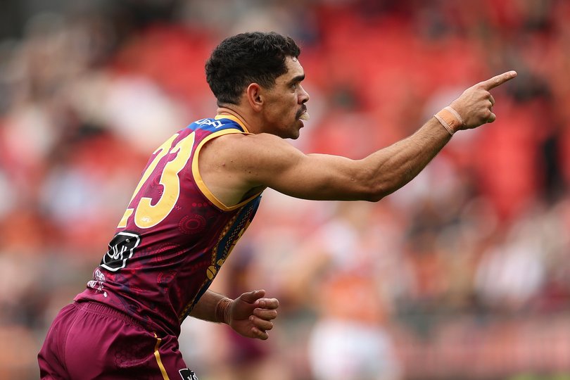 Charlie Cameron celebrates kicking a goal.