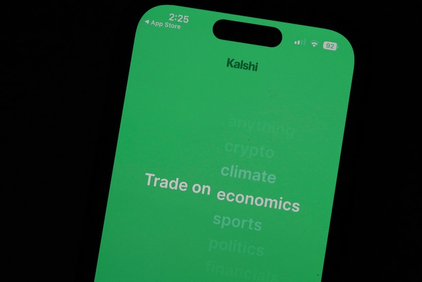 A phone screen showing a green loading screen.