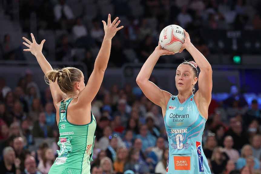 Jamie-Lee Price of the Mavericks passes the ball.
