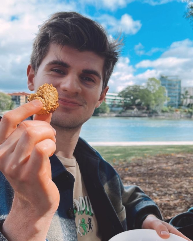 Sam Ford enjoying an Anzac biscuit on Anzac Day.