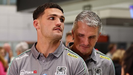 Nathan Cleary (left) and his dad Ivan Cleary at Brisbane airport on Saturday night.
