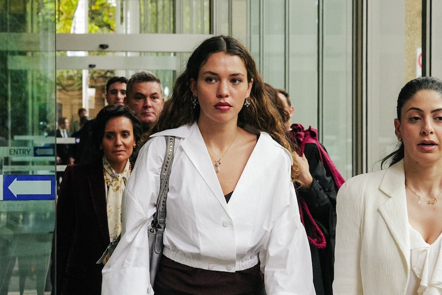 Ms MacInnes walking out of court.