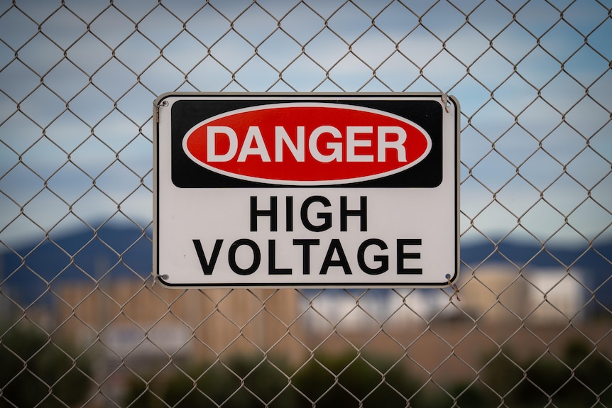 A view iof a sign which reads Danger High Voltage in the vicinity of Port Augusta in SA.
