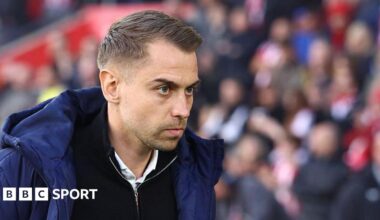 Southampton manager Tonda Eckert in blue coat and black zip-up top